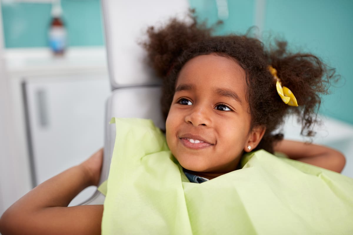 girl at dentist smiling