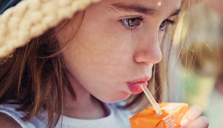 Child with sugary drink