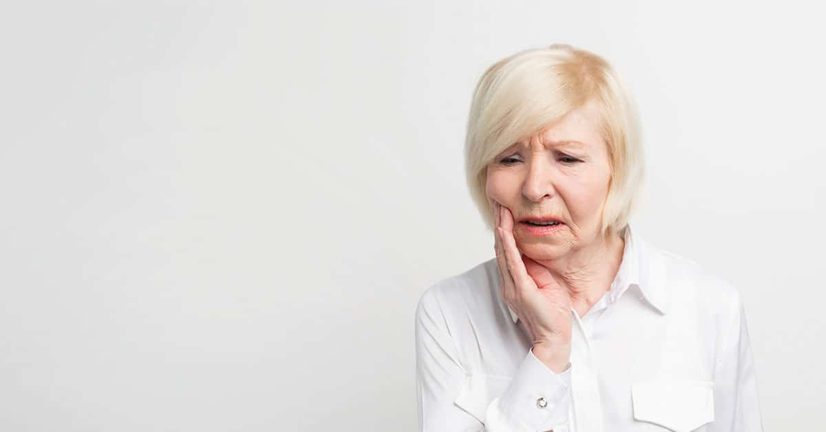 Woman with mouth pain