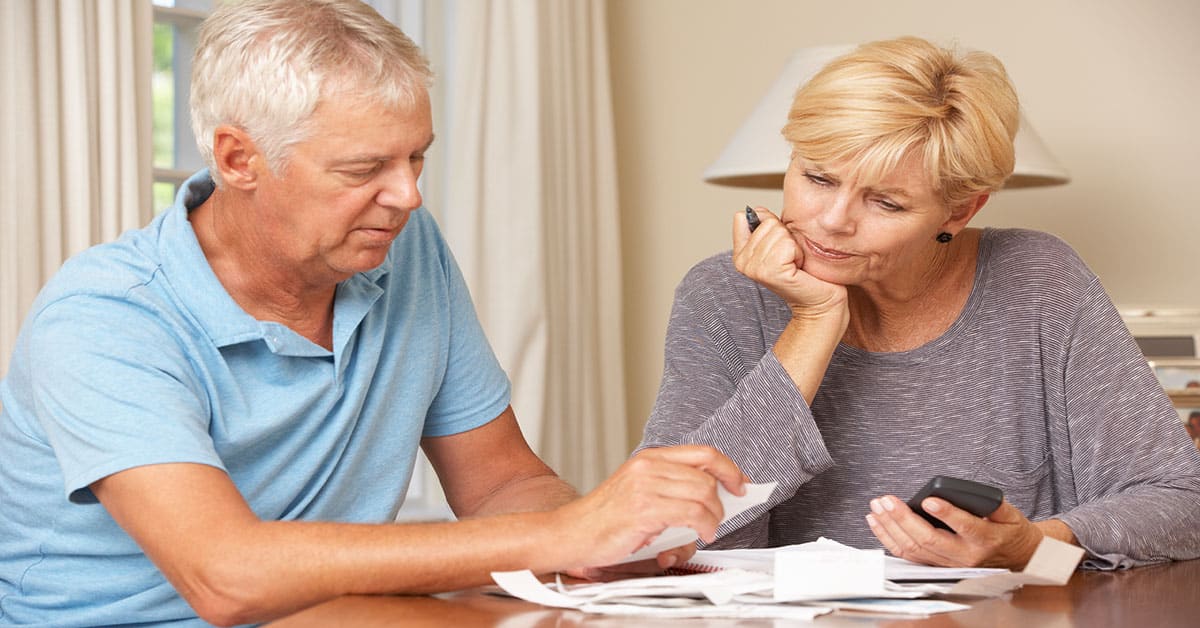 Couple looking at bills