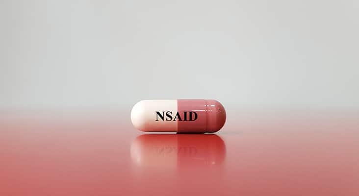 Capsule of NSAID drug on white background(Nonsteroidal anti-inflammatory drug). This medication used for pain control, decrease inflammation, fever treatment, prevent blood clot.