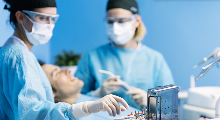 Dentists with a patient during a dental intervention. Dentist Concept