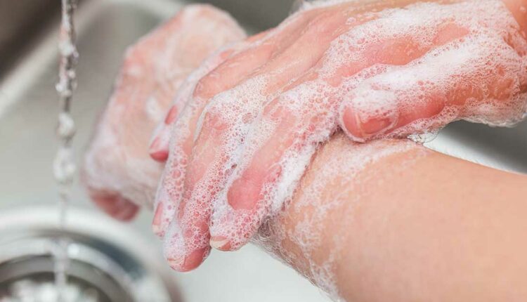 Person practicing hand hygiene