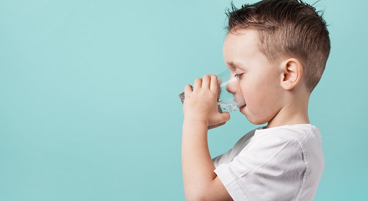 model boy posing on gray background