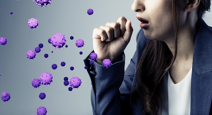 woman coughing and graphics of virus coming out