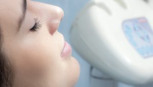 close up of a patient in chair with eyes closed