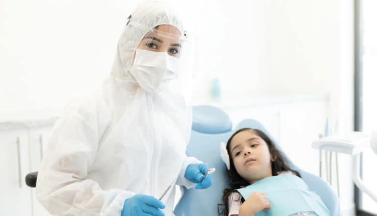 doctor in safety gear with patient