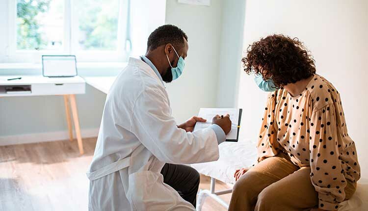 doctor showing patient notes