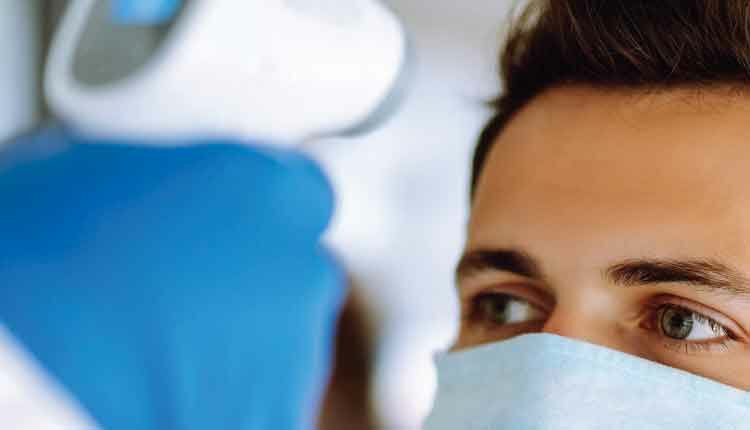 patient getting temperature checked