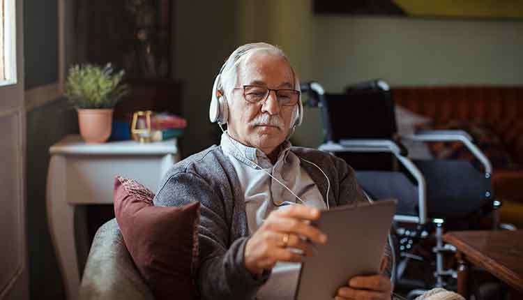 Senior Man using a Tablet at Home