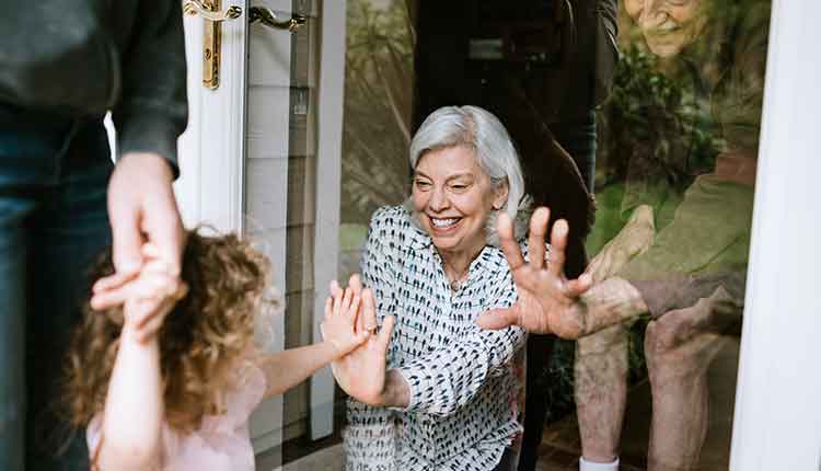 Little Girl Visits Grandparents Through Window