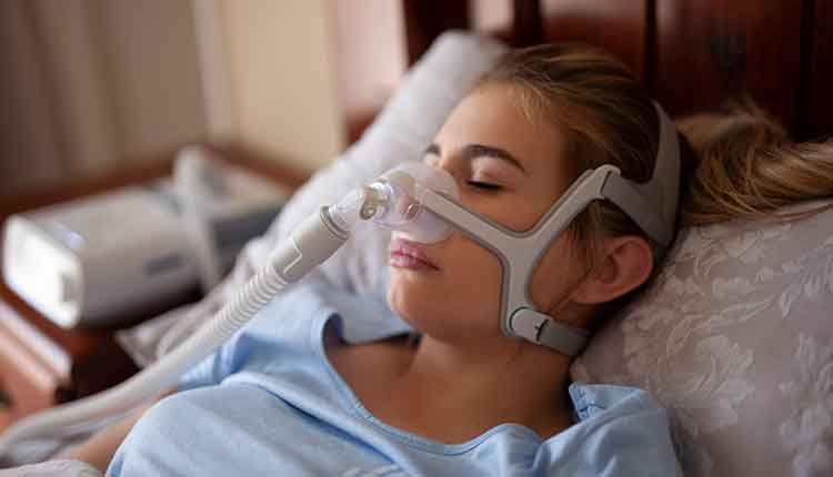 woman with cpap machine on