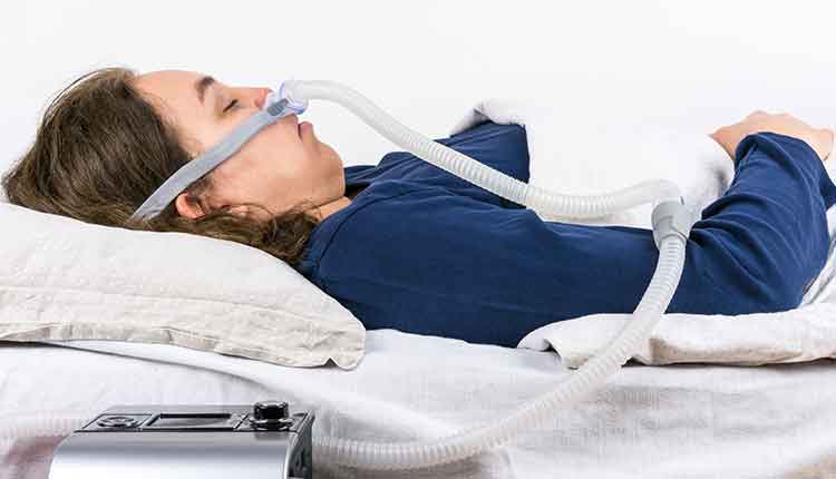 woman with cpap machine on