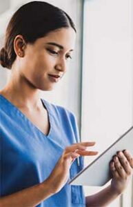 Female dental hygienist using an ipad or tablet