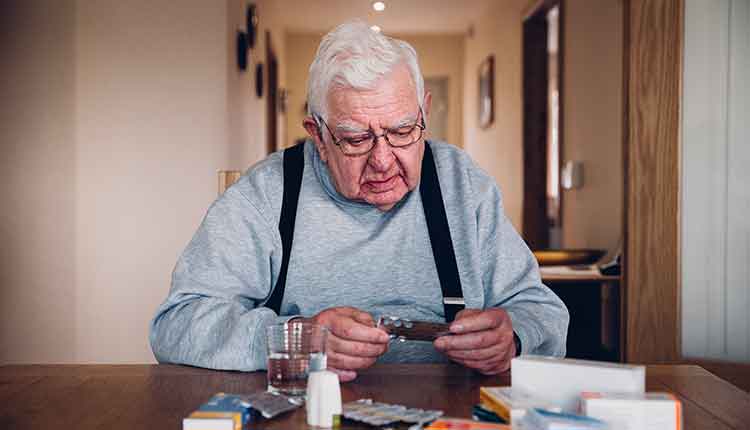 Elderly Man with all his Medication