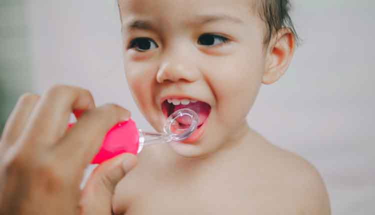 girl during checking tooth and by dental mirror tools toy