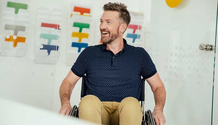 man in wheelchair smiling