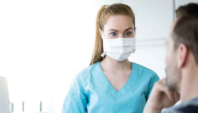 Dental hygienist wearing am ask