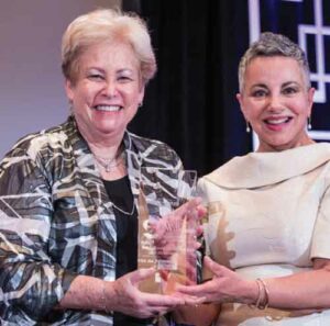 Jane L. Forrest, BSDH, MS, EdD, receiving The Esther Wilkins Lifetime Achievement Award from Dimensions of Dental Hygiene’s Editor in Chief Jill Rethman, RDH, BA.