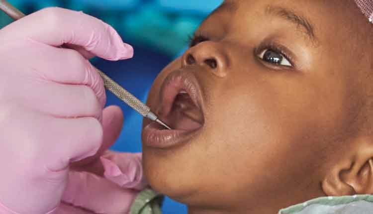 close up of child at dentist