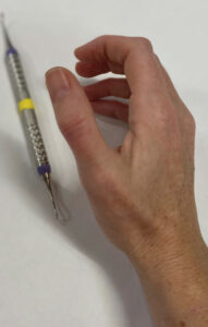 FIGURE 4. During sustained pinching activities, tendons can be taxed to a point where inflammation forms, creating localized discomfort where the lateral thumb meets the wrist.