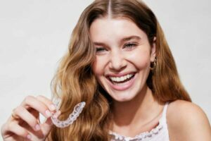 woman with aligner