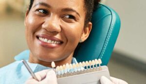 woman getting teeth shade matched