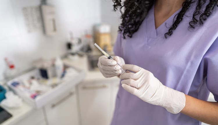 Nurse preparing injection in doctor's office