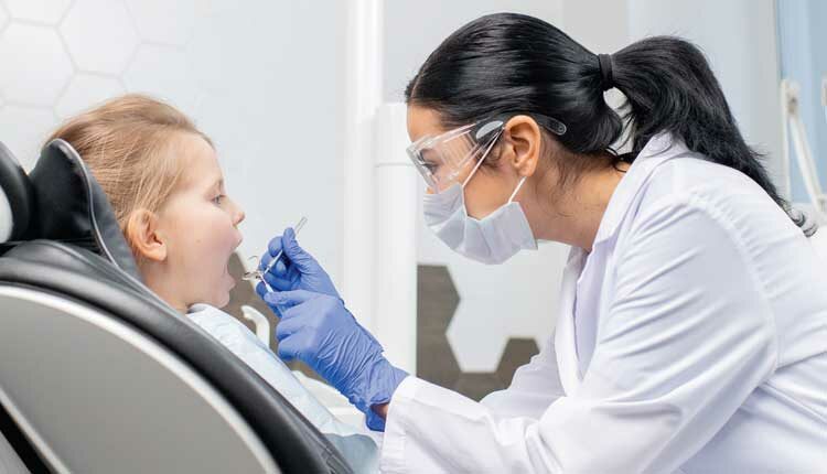 young girl at dentist