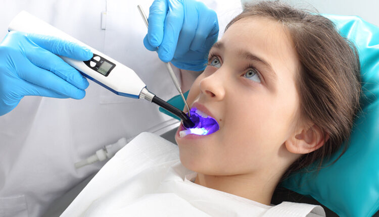 Child in the dental chair dental treatment during surgery.