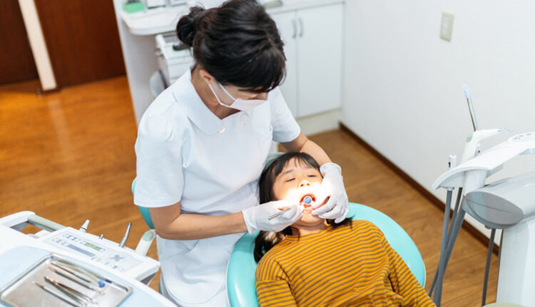 Small girl getting check up at dentist