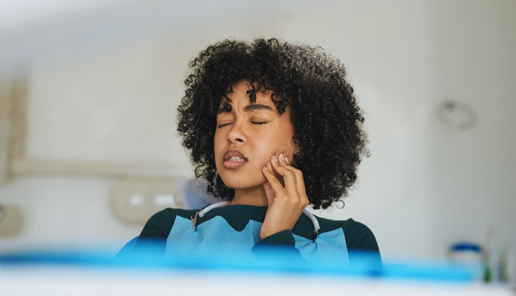 woman having tooth pain