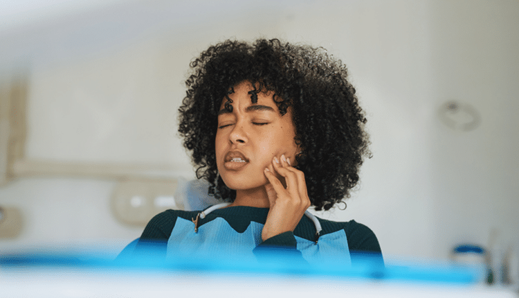 woman having tooth pain