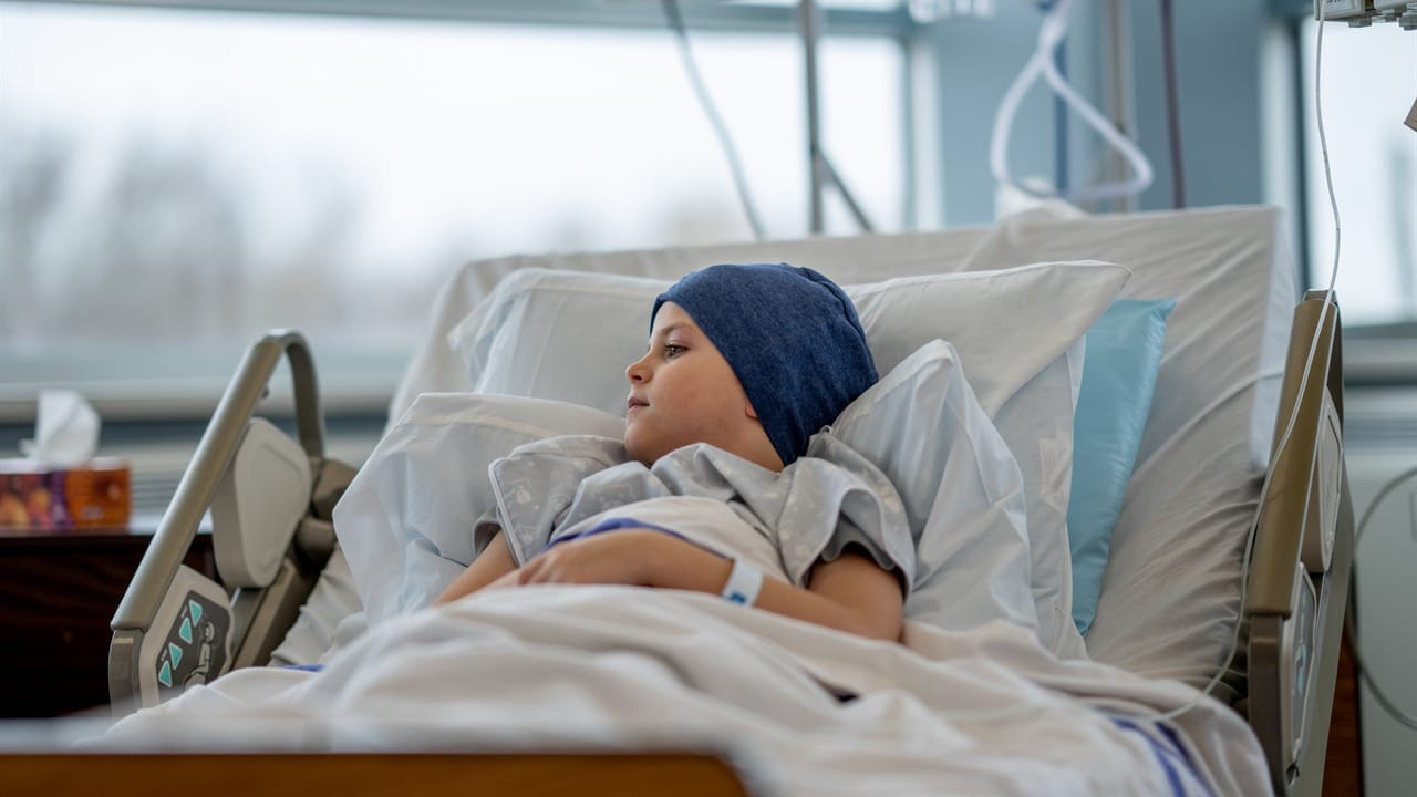 Young oncology patient resting in a hospital bed